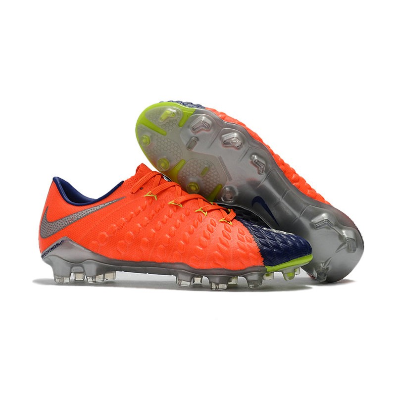 orange and blue soccer cleats