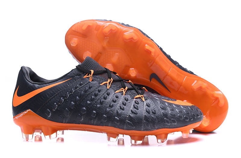 nike black and orange cleats