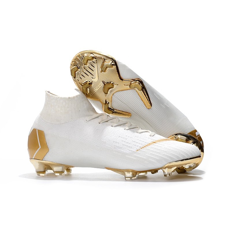 white and gold nike boots