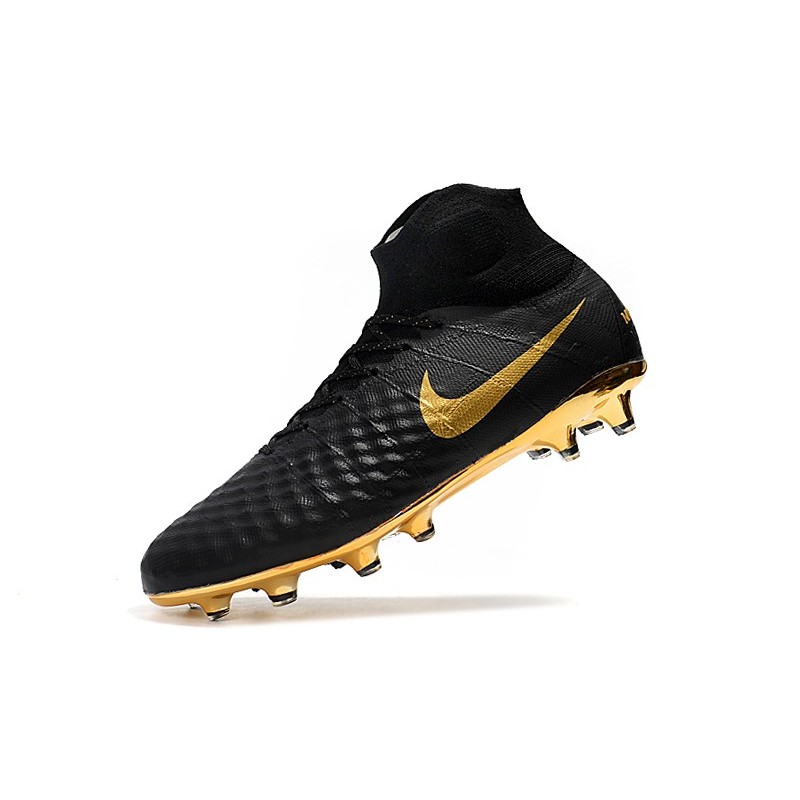 nike football boots black and gold