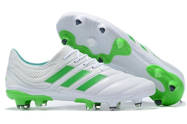 white and green soccer cleats