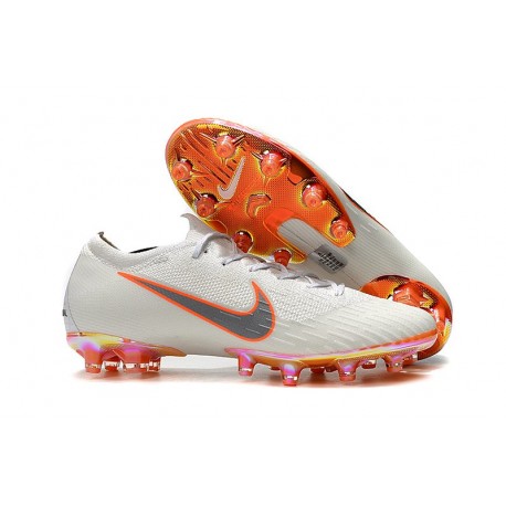 white and orange mercurial