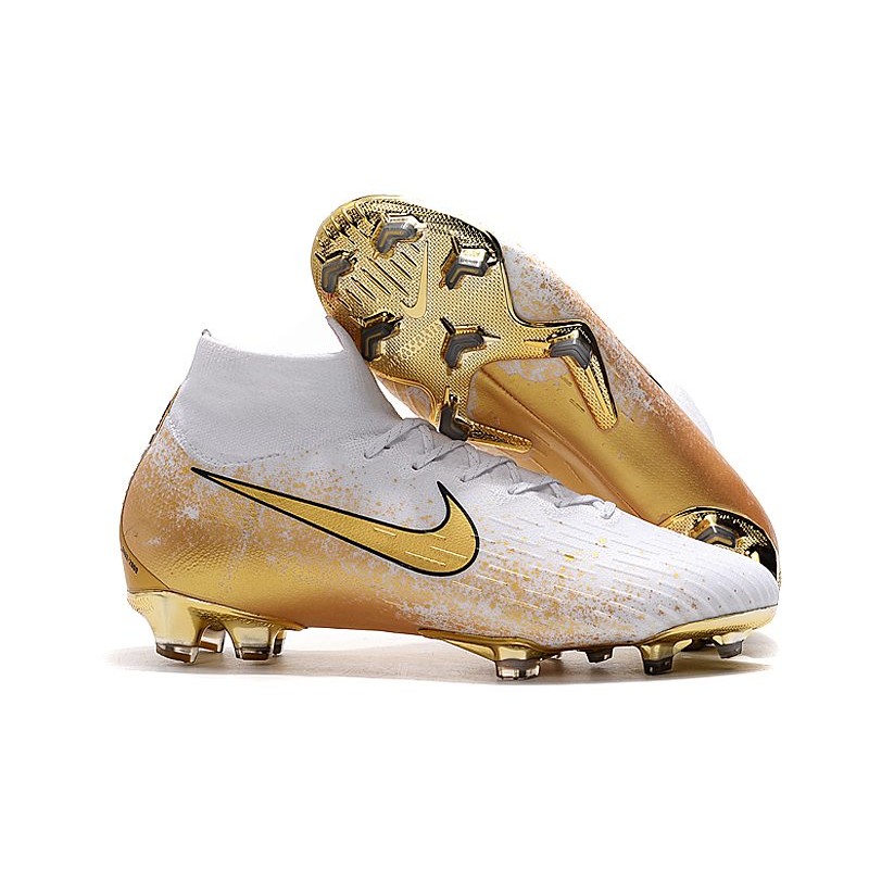 white and gold nike boots