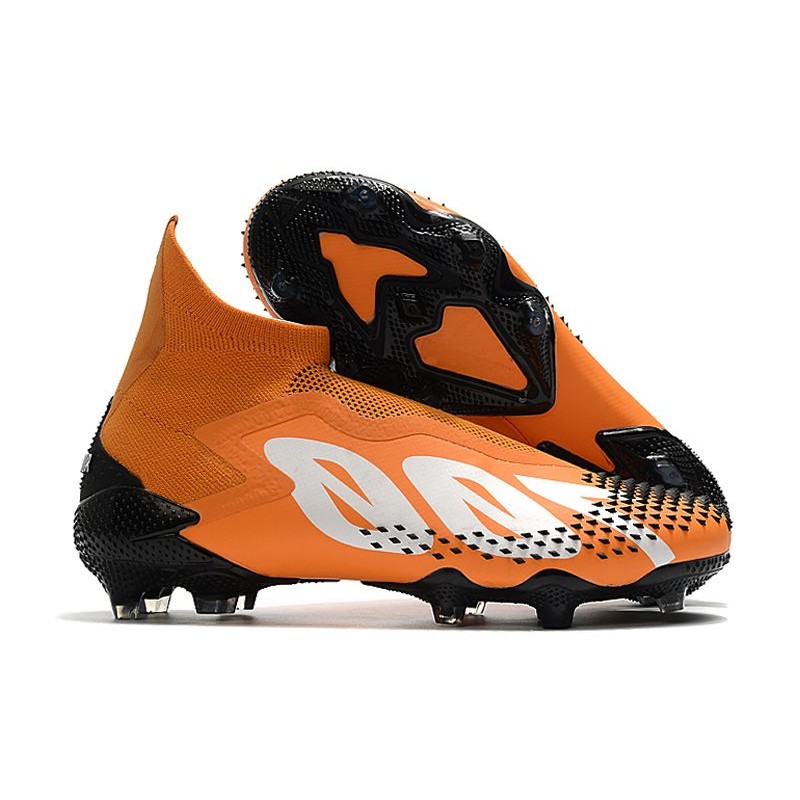 orange and white soccer cleats